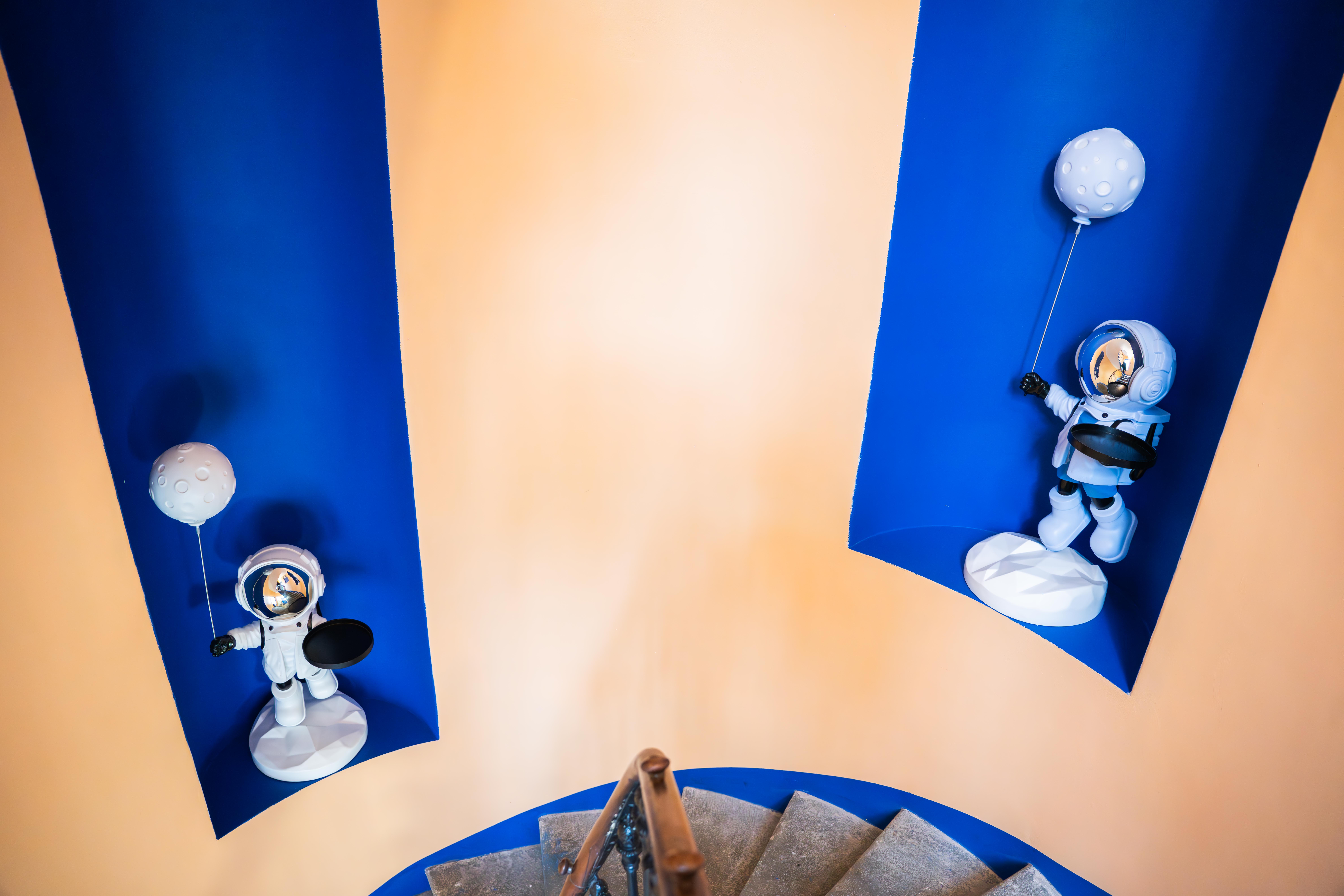Astronaut figurines on staircase